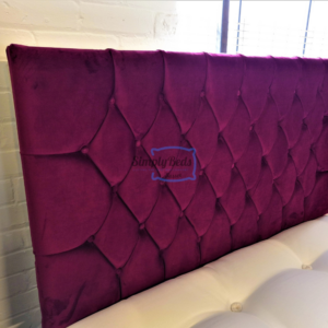 Photo taken at an angle of the Jakarta headboard in plush red colour