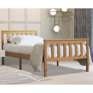 Marnel oak bed frame pictured face on with mattress, bedding and pillows