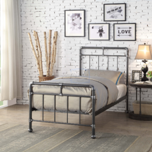 Studio image taken at an angle of the black and silver industrial looking metal bed frame in single size