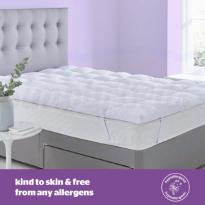 Studio image of the Silentnight Deep Sleep Ultimate Mattress Topper 500 on an undressed bed