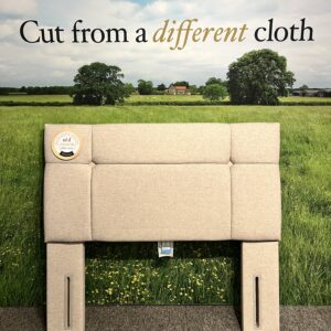 Picture of a Harrison Spinks Atalanta Headboard in a bedroom showroom.