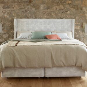 life image of a Harrison Spinks Lalique deep winged headboard.