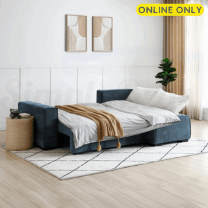 Lifestyle image of the Harrison Corner Sofa Bed in navy chenille fabric - set in sleeping position and dressed