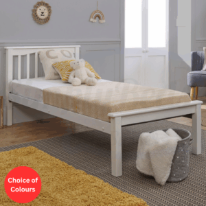 Lifestyle image of a white wooden bed frame with low foot end and a semi dressed mattress