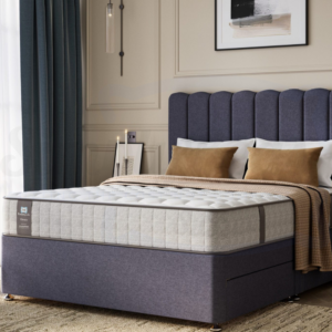 Studio image taken at an angle of the Sealy Chapman mattress on a bed